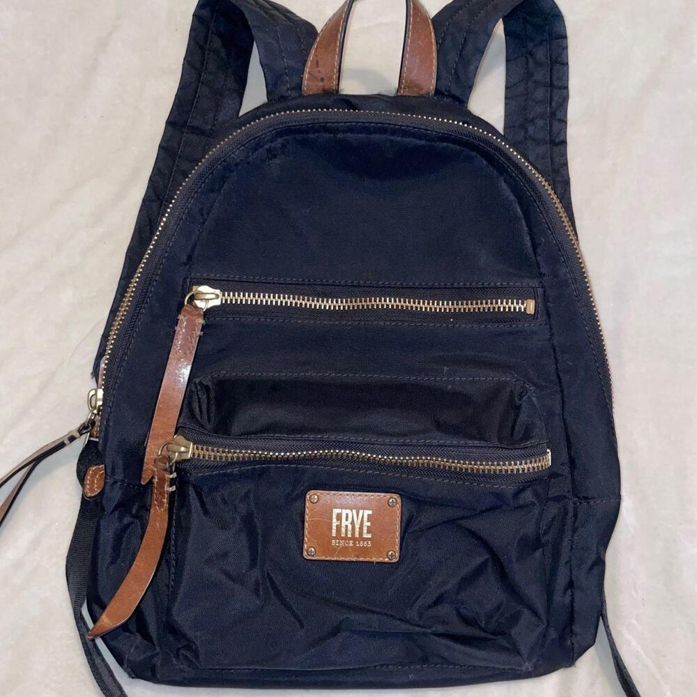 Black Frye backpack w/ brown leather trim, god tone zipper